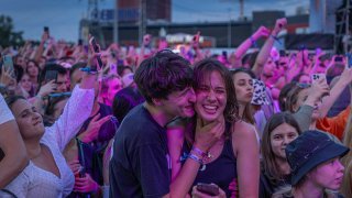 People enjoy a concert at the Atlas Festival in Kyiv.