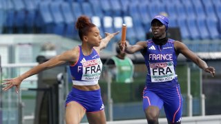 ROME, ITALY - JUNE 11: Sylla Sounkamba of team France handing her baton to Alexe Deau of the team France competing o 4 x 400m Relay Women during day five of the 26th European Athletics Championships - Rome 2024 at Stadio Olimpico on June 11, 2024 in Rome, Italy.