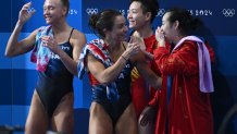 Kassidy Cook and Sarah Bacon congratulates China's Chang Yani and Chen Yiwen