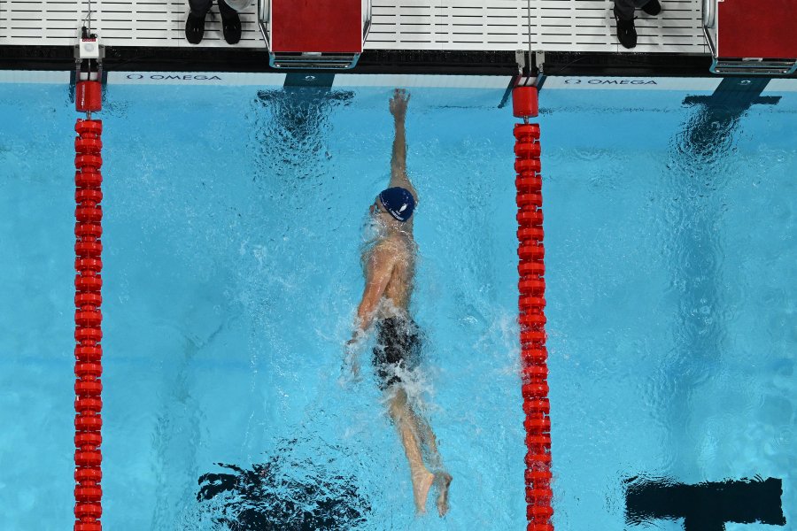 An overview shows France's Leon Marchand winning the final of the men's 400m individual medley swimming event