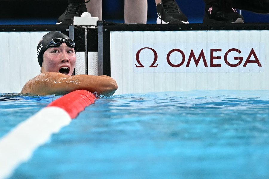 US' Torri Huske celebrates after winning the final of the women's 100m butterfly swimming event