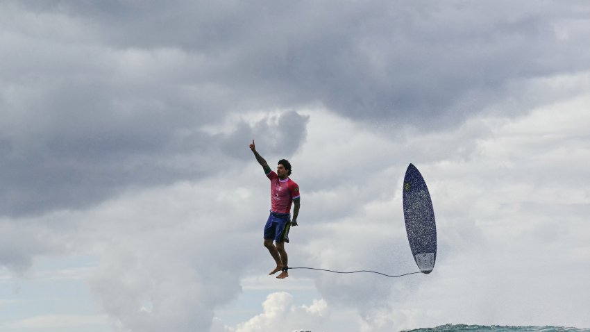 TOPSHOT - Brazil's Gabriel Medina reacts after getting a large wave in the 5th heat of the men's surfing round 3, during the Paris 2024 Olympic Games, in Teahupo'o, on the French Polynesian Island of Tahiti, on July 29, 2024. (Photo by Jerome BROUILLET / AFP) (Photo by JEROME BROUILLET/AFP via Getty Images)