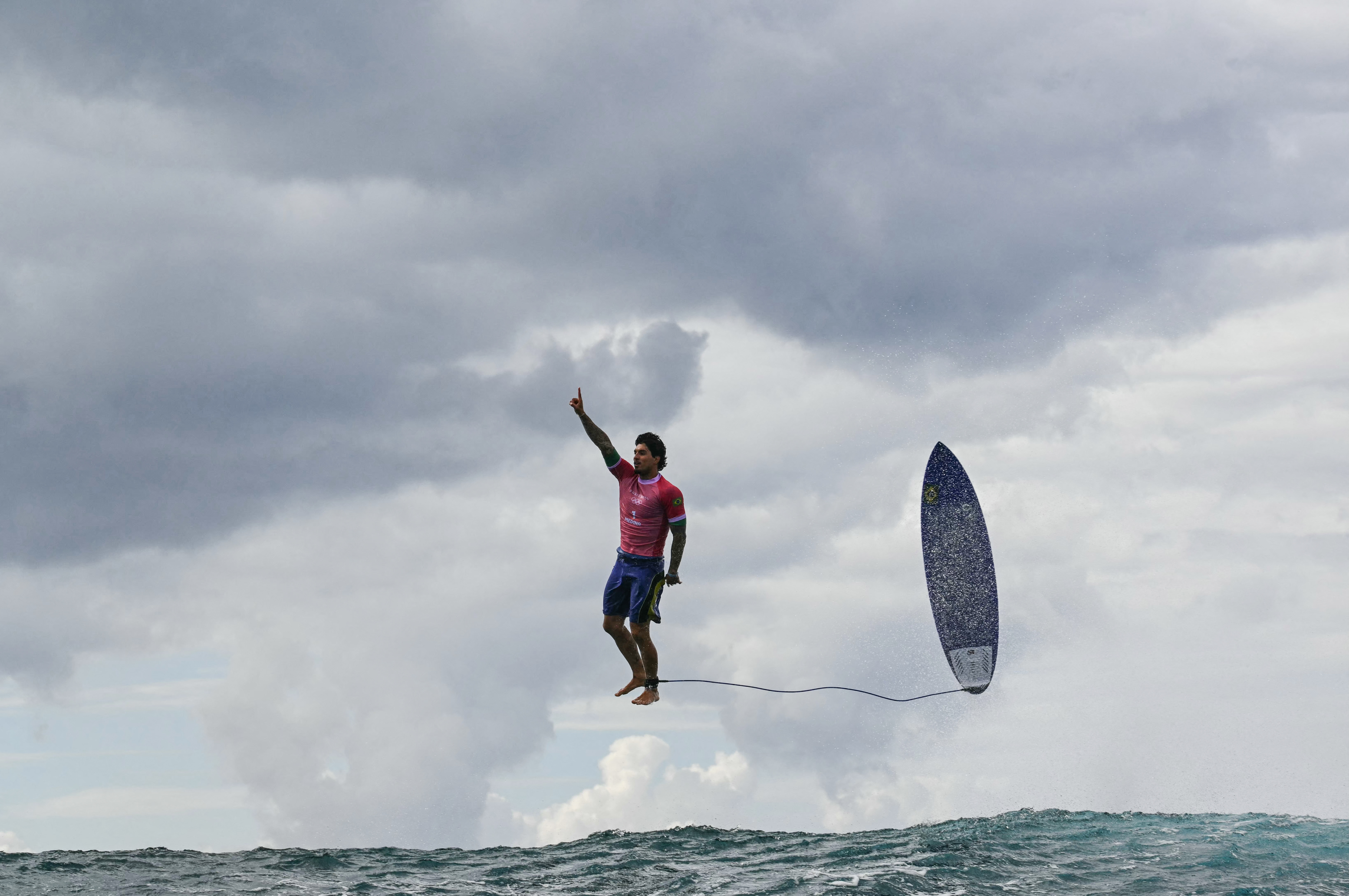 TOPSHOT - Brazil's Gabriel Medina reacts after getting a large wave in the 5th heat of the men's surfing round 3, during the Paris 2024 Olympic Games, in Teahupo'o, on the French Polynesian Island of Tahiti, on July 29, 2024. (Photo by Jerome BROUILLET / AFP) (Photo by JEROME BROUILLET/AFP via Getty Images)