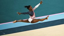 TOPSHOT - US' Simone Biles competes in the floor exercise event of the artistic gymnastics women's team final during the Paris 2024 Olympic Games at the Bercy Arena in Paris, on July 30, 2024. (Photo by Paul ELLIS / AFP) (Photo by PAUL ELLIS/AFP via Getty Images)