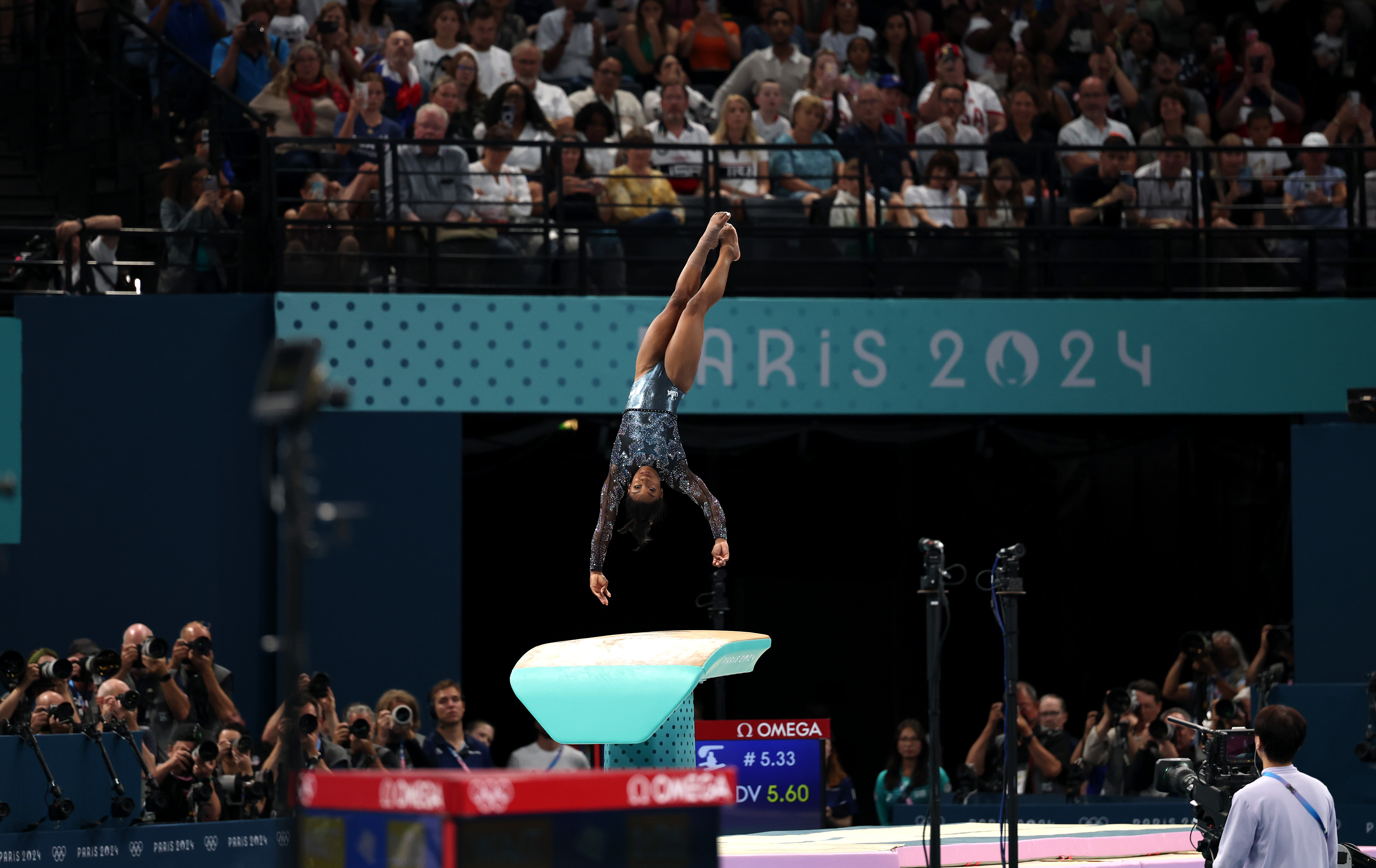 Simone Biles competes on the vault