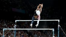 PARIS, FRANCE - JULY 30: Simone Biles of Team United States competes on the uneven bars during the Artistic Gymnastics Women's Team Final on day four of the Olympic Games Paris 2024 at Bercy Arena on July 30, 2024 in Paris, France. (Photo by Naomi Baker/Getty Images)