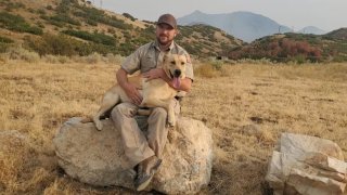 Emery County Sheriff’s Officer and dog Kip.