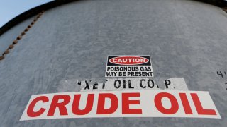 A sticker reads crude oil on the side of a storage tank in the Permian Basin in Mentone, Loving County, Texas, U.S. November 22, 2019.