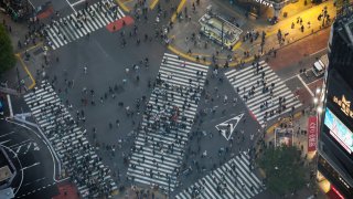 Pedestrians cross an intersection in the Shibuya district of Tokyo, Japan, on Tuesday, April 25, 2023. Photographer: Kentaro Takahashi/Bloomberg via Getty Images