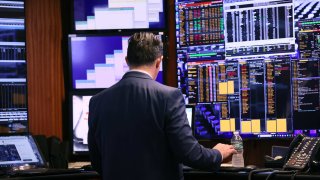 Traders work on the floor of the New York Stock Exchange during morning trading on Oct. 4, 2023.