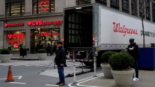 A Walgreens truck parks near a CVS Pharmacy on March 10, 2023 in New York City.