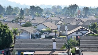 Rooftops of homes in a gated residential community are seen in Pico Rivera, California, on Jan. 18, 2024.