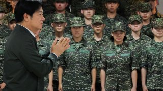 Taiwan President Lai Ching-te claps while he visits a military camp in Taoyuan, Taiwan May 23, 2024. 