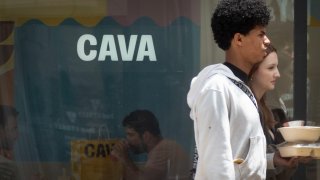 Customers take out food from a Cava restaurant in Chicago, Illinois, on May 28, 2024.