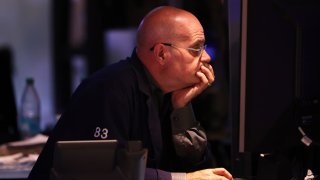 Traders work on the floor of the New York Stock Exchange during afternoon trading on Aug. 2, 2024.