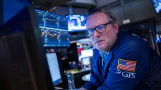 A trader works on the floor of the New York Stock Exchange.