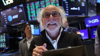 Traders work on the floor at the New York Stock Exchange (NYSE) in New York City, U.S., August 8, 2024.