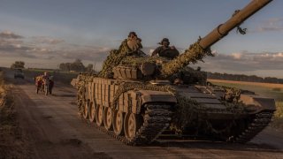 Ukrainian servicemen operate a Soviet-made T-72 tank in the Sumy region, near the border with Russia, on August 12, 2024, amid the Russian invasion of Ukraine. 