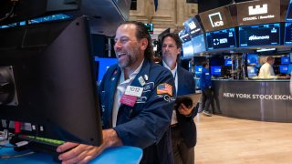 Traders work on the floor of the New York Stock Exchange (NYSE) on August 14, 2024 in New York City.