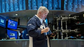 Traders work the floor of the New York Stock Exchange on August 16, 2024. 