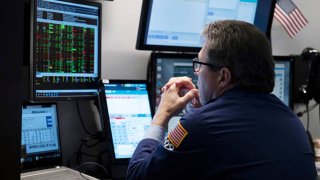 Traders work the floor of the New York Stock Exchange on August 16, 2024. 