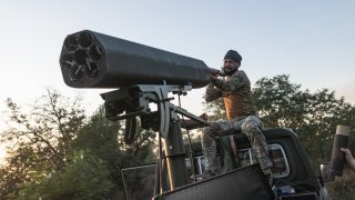 Ukrainian soldiers prepare a vehicle adapted to fire helicopter shells as the Russia-Ukraine war continues in the direction of Toretsk, Ukraine, Aug. 19, 2024. 