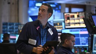 Traders work on the floor of the New York Stock Exchange (NYSE) during morning trading in New York on August 23, 2024. 