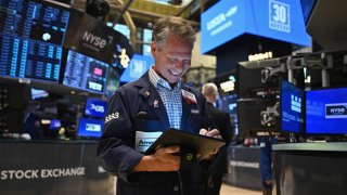 Traders work on the floor of the New York Stock Exchange (NYSE) during morning trading in New York on August 23, 2024. 