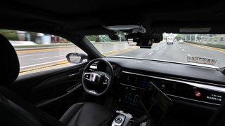 TOPSHOT – The photo taken on August 1, 2024 shows a general view of the driver’s seat and controls of a driverless robotaxi autonomous vehicle developed as part of tech giant Baidu’s Apollo Go self-driving project, in Wuhan, in central China’s Hubei province. Turning heads as they cruise past office buildings and malls, driverless taxis are slowly spreading through Chinese cities, prompting both wariness and wonder. (Photo by Pedro PARDO / AFP) / To go with: CHINA-TECHNOLOGY-AUTOMOTIVE, FOCUS by Jing Xuan TENG (Photo by PEDRO PARDO/AFP via Getty Images)