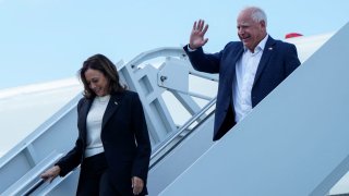 Democratic presidential nominee and U.S. Vice President Kamala Harris and vice presidential nominee Tim Walz walk down the steps from Air Force Two at Savannah/Hilton Head International Airport in Savannah, Georgia, U.S., August 28, 2024.