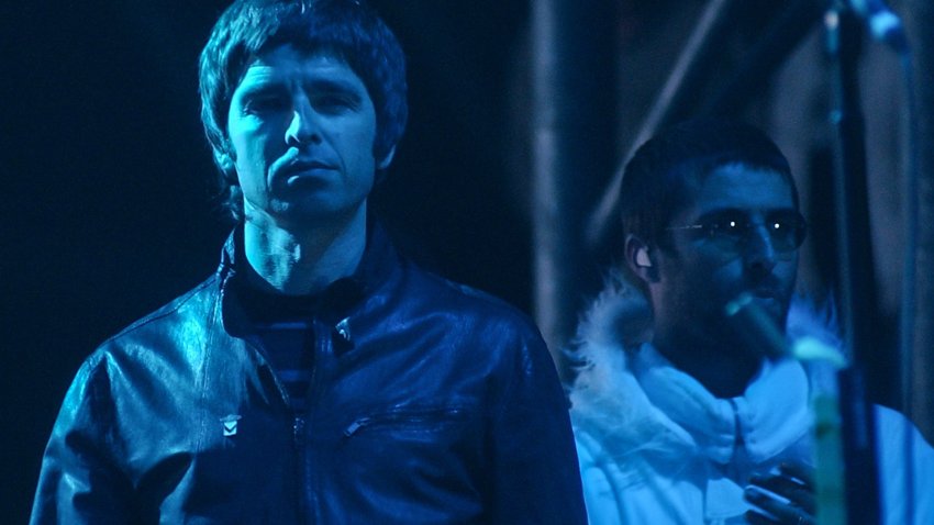 Noel and Liam Gallagher performing