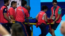 Slovakia’s Tamara Potocka is taken on stretcher from the pool deck after collapsing following a heat of the women's 200-meter individual medley at the 2024 Summer Olympics, Friday, Aug. 2, 2024, in Nanterre, France. (AP Photo/Tsvangirayi Mukwazhi)