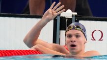 Leon Marchand of France, celebrates after winning the men's 200-meter individual medley final at the 2024 Summer Olympics, Friday, Aug. 2, 2024, in Nanterre, France. (AP Photo/Natacha Pisarenko)