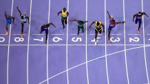 Noah Lyles, of the United States, in lane seven, wins the men's 100-meter final at the 2024 Summer Olympics, Sunday, Aug. 4, 2024, in Saint-Denis, France. (AP Photo/David J. Phillip)