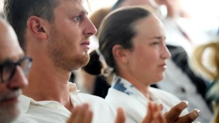 Israeli gold medalist windsurfer Tom Reuveny, left, and cyclist Rotem Gafinovitz, attend a ceremony in remembrance of the 11 Israeli athletes killed during the 1972 Munich Olympic Games, at the 2024 Summer Olympics, Tuesday, Aug. 6, 2024, in Paris, France.