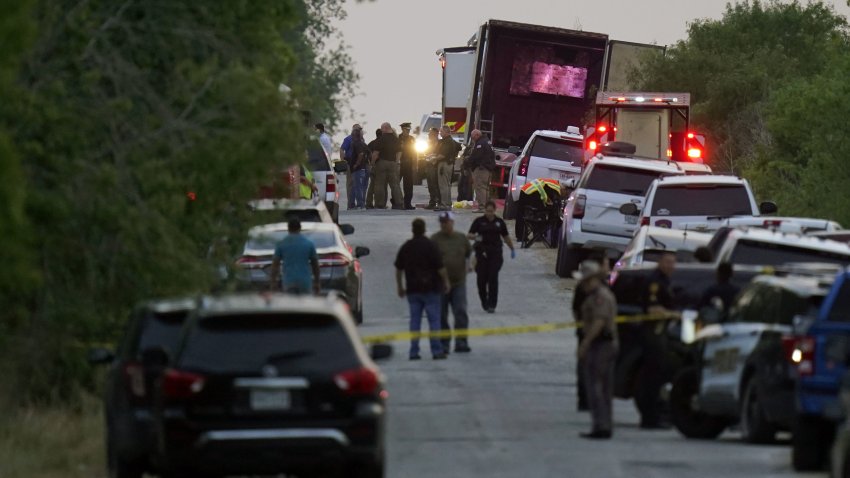 FILE – Police and other first responders work the scene where officials say dozens of people have been found dead and multiple others were taken to hospitals with heat-related illnesses after a tractor-trailer containing suspected migrants was found on June 27, 2022, in San Antonio. (AP Photo/Eric Gay, File)