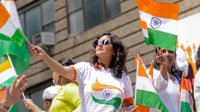 MADISON AVENUE, NEW YORK CITY, NY, UNITED STATES – 2019/08/18: A woman waves an Indian flag during the 39th Annual India Day Parade held at the Madison Avenue in New York City. (Photo by Efren Landaos/SOPA Images/LightRocket via Getty Images)