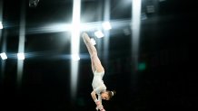 TOPSHOT - Algeria's Kaylia Nemour competes in the artistic gymnastics women's uneven bars final during the Paris 2024 Olympic Games at the Bercy Arena in Paris, on August 4, 2024. (Photo by Loic VENANCE / AFP) (Photo by LOIC VENANCE/AFP via Getty Images)