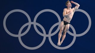 Britain’s Jack Laugher competes in the men’s 3m springboard diving semi-final during the Paris 2024 Olympic Games at the Aquatics Centre in Saint-Denis, north of Paris, on August 7, 2024. (Photo by OLI Scarff/AFP via Getty Images)