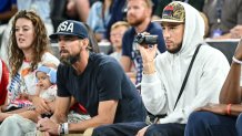 Michael Phelps and Devin Booker of USA looks on during the Women's Basketball Quarterfinal match between Nigeria and United State on Day 12 of the Olympic Games Paris 2024 at Bercy Arena on August 7, 2024 in Lille, France. (Photo by Harry Langer/DeFodi Images via Getty Images)