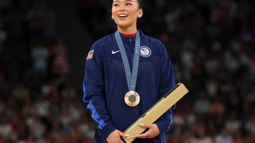 PARIS, FRANCE – AUGUST 04: Bronze medalist Sunisa Lee of Team United States looks on from the podium during the medal ceremony for the Artistic Gymnastics Women’s Uneven Bars Final on day nine of the Olympic Games Paris 2024 at Bercy Arena on August 04, 2024 in Paris, France. (Photo by Jamie Squire/Getty Images)