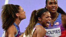 Gold medallists US' Sydney Mclaughlin-Levrone, US' Gabrielle Thomas and US' Alexis Holmes celebrate after competing in the women's 4x400m relay final of the athletics event at the Paris 2024 Olympic Games at Stade de France in Saint-Denis, north of Paris, on August 10, 2024. (Photo by Martin  BERNETTI / AFP) (Photo by MARTIN  BERNETTI/AFP via Getty Images)