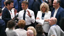 US television personality Jimmy Fallon (L) speaks with Emmanuel Macron (2nd L) as his wife Brigitte Macron (2nd R) and US second gentleman Doug Emhoff (R) look on in the men's Gold Medal basketball match between France and USA during the Paris 2024 Olympic Games at the Bercy  Arena in Paris on August 10, 2024. (Photo by Paul ELLIS / AFP) (Photo by PAUL ELLIS/AFP via Getty Images)