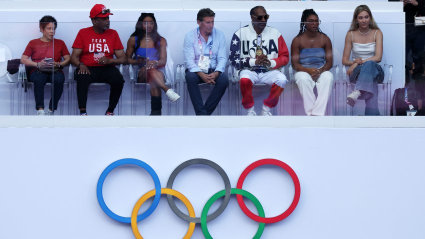 PARIS, FRANCE – AUGUST 08: Gymnast Simone Biles, World Athletics President Sebastian Coe, Rapper and Record Producer Snoop Dogg and Freestyle skier Eileen Gu attend the Athletics evening session on day thirteen of the Olympic Games Paris 2024 at Stade de France on August 08, 2024 in Paris, France. (Photo by Al Bello/Getty Images)