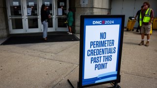 A credentialing sign outside of the United Center ahead of the Democratic National Convention (DNC) in Chicago, Illinois, US, on Friday, Aug. 16, 2024. City officials are eager to avoid any echoes of the 1968 Chicago Democratic National Convention, when a bus strike added a little extra chaos to a protest-filled event.