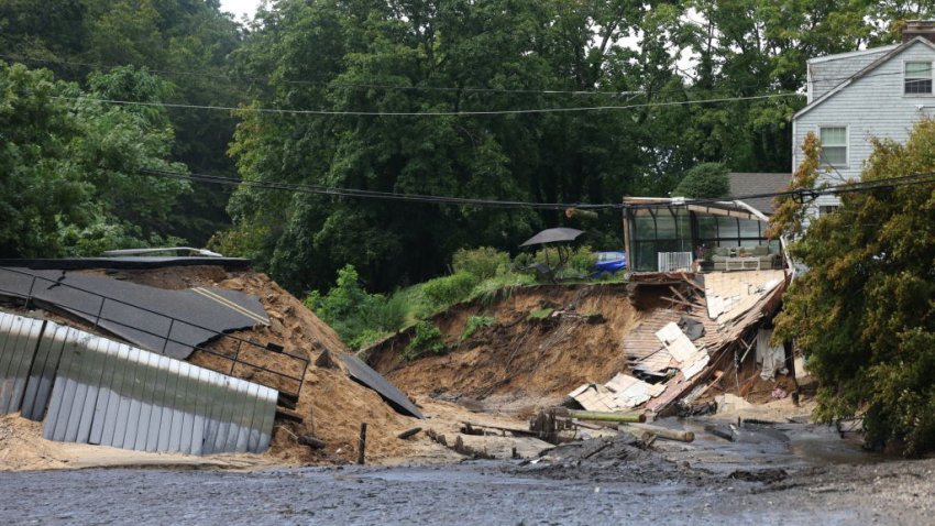 Stony Brook, N.Y.: Mill Pond Dam at Harbor Road, and a house, right, on Main Street, collapsed caused by flooding from an overnight storm that brought 10 inches of rain, to Stony Brook, New York, on August 19, 2024. (Photo by James Carbone/Newsday RM via Getty Images)