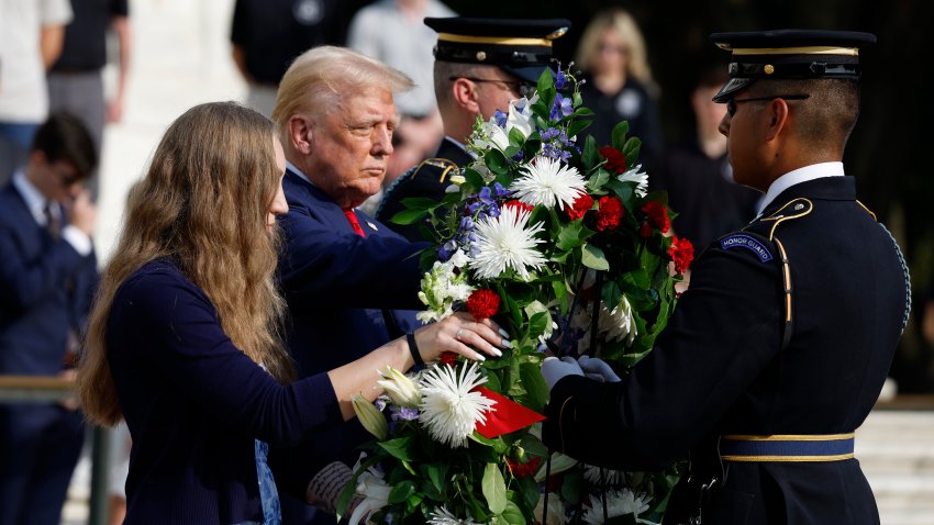 Donald Trump stands alongside Misty Fuoco, whose sister Sgt. Nicole Gee died in Abbey Gate Bombing, at a wreath laying ceremony