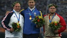 Gold medalist Yuriy Bilonog of Ukraine, silver medalist Adam Nelson of USA (L) and bronze medalist Joachim Olsen of Denmark during the medal ceremony of the men's shot put event during the Athens 2004 Summer Olympic Games.