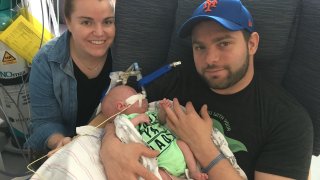 JoJo Caccamo with his parents, Katie and Phil. The non-profit Rebuilding Together Long Island helped to modify the family’s house after JoJo was born prematurely.