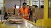 Amazon increases average pay for warehouse workers and adds free Prime membership perk